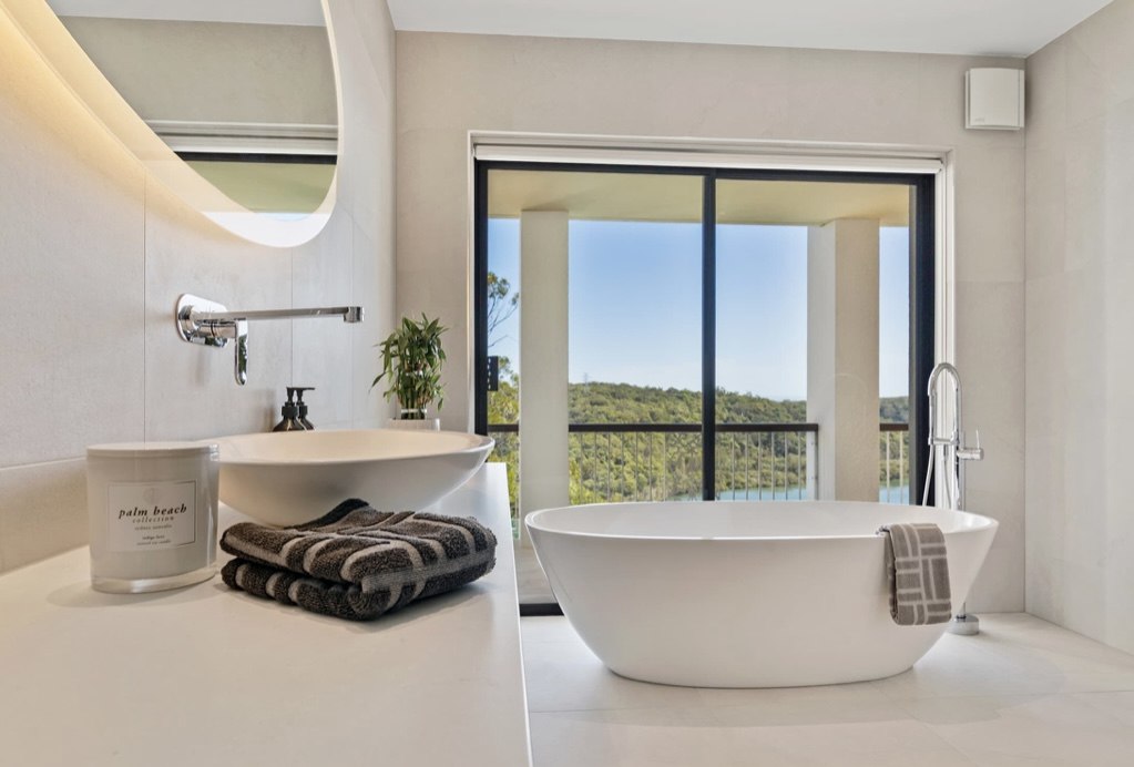 Freestanding bath with coastal bushland view