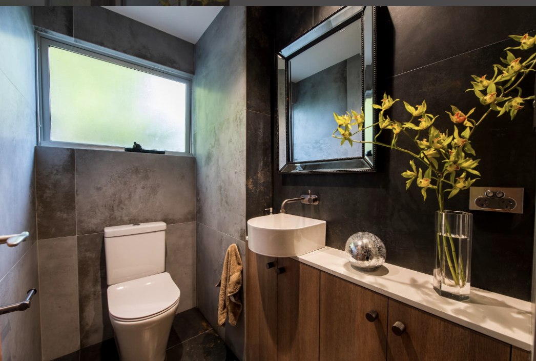 Moody dark-tile powder room, Sydney bathroom renovation